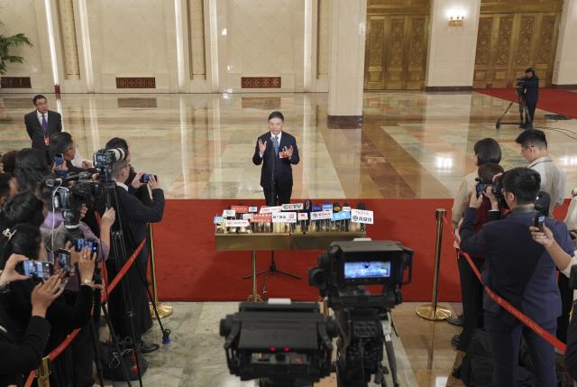 (260312) -- BEIJING, March 12, 2026 (Xinhua) -- China's Minister of Ecology and Environment Huang Runqiu gives an interview after the closing meeting of the fourth session of the 14th National People's Congress (NPC) at the Great Hall of the People in Beijing, capital of China, March 12, 2026. (Xinhua/Wang Xi)