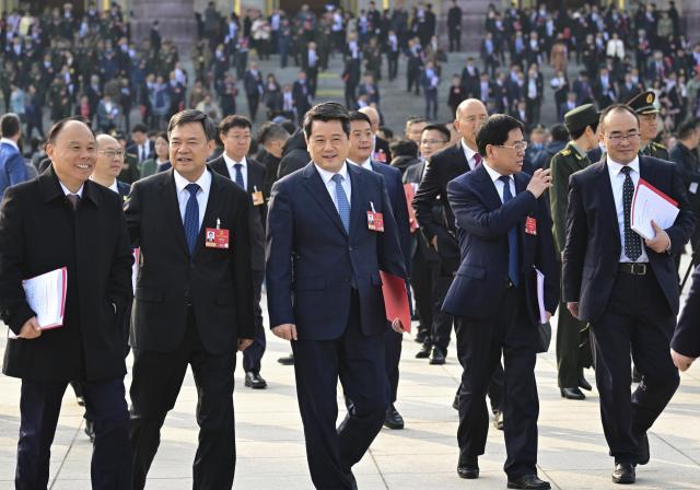 (260312) -- BEIJING, March 12, 2026 (Xinhua) -- Deputies to the 14th National People's Congress (NPC) leave the Great Hall of the People after the closing meeting of the fourth session of the 14th NPC in Beijing, capital of China, March 12, 2026. (Xinhua/Chen Yehua)