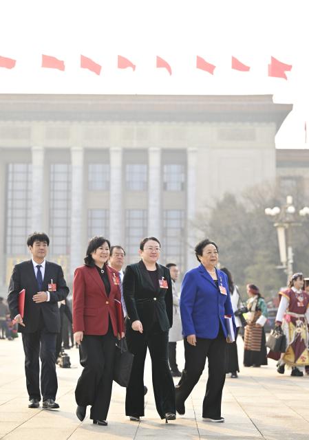 (260312) -- BEIJING, March 12, 2026 (Xinhua) -- Deputies to the 14th National People's Congress (NPC) leave the Great Hall of the People after the closing meeting of the fourth session of the 14th NPC in Beijing, capital of China, March 12, 2026. (Xinhua/Yue Yuewei)