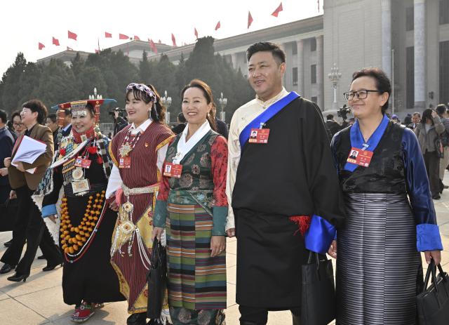 (260312) -- BEIJING, March 12, 2026 (Xinhua) -- Deputies to the 14th National People's Congress (NPC) leave the Great Hall of the People after the closing meeting of the fourth session of the 14th NPC in Beijing, capital of China, March 12, 2026. (Xinhua/Chen Yichen)