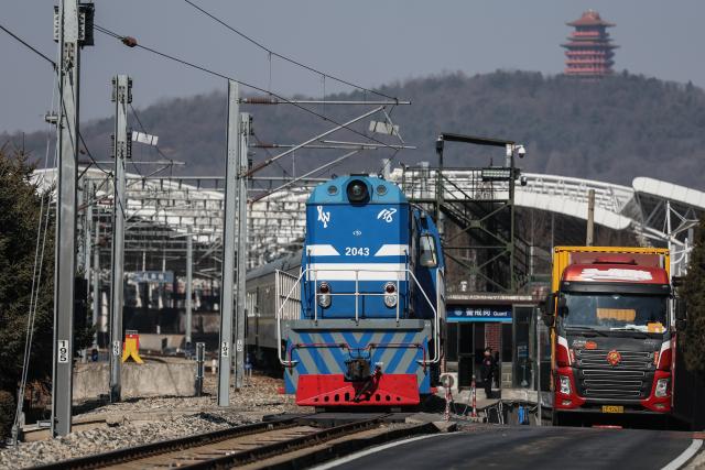(260312) -- DANDONG, March 12, 2026 (Xinhua) -- The train No. 95 from Dandong of China to Pyongyang of the Democratic People's Republic of Korea (DPRK) departs from Dandong Railway Station in Dandong, northeast China's Liaoning Province, March 12, 2026. An international passenger train linking Dandong in northeast China's Liaoning Province with Pyongyang, capital of the Democratic People's Republic of Korea (DPRK), began service on Thursday.
   The passenger service will operate daily in both directions. (Xinhua/Pan Yulong)