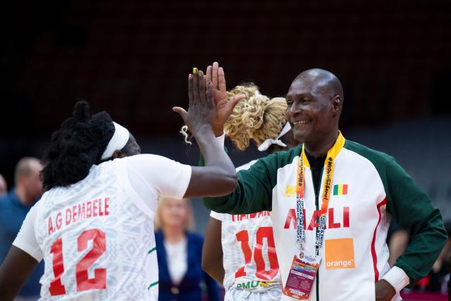 (260312) -- WUHAN, March 12, 2026 (Xinhua) -- Oumarou Sidiya (R), head coach of Mali, celebrates after the group A match between the Czech Republic and Mali at FIBA Women's World Cup Qualifying Tournaments in Wuhan, central China's Hubei Province, Feb. 12, 2026. (Xinhua/Wu Zhizun)