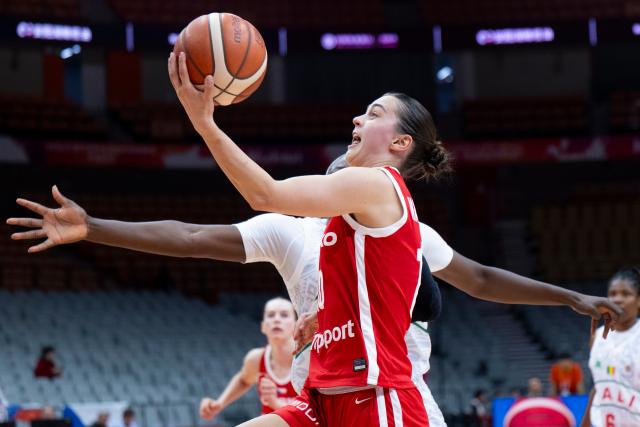 (260312) -- WUHAN, March 12, 2026 (Xinhua) -- Eliska Hamzova of the Czech Republic goes for a lay-up during the group A match between the Czech Republic and Mali at FIBA Women's World Cup Qualifying Tournaments in Wuhan, central China's Hubei Province, Feb. 12, 2026. (Xinhua/Wu Zhizun)