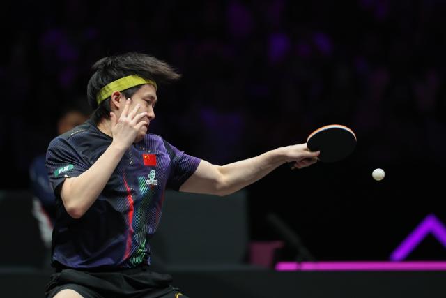 (260312) -- CHONGQING, March 12, 2026 (Xinhua) -- Wang Chuqin of China hits a return during the men's singles round of 16 match against Patrick Franziska of Germany at the WTT Champions Chongqing 2026 in southwest China's Chongqing, March 12, 2026. (Xinhua/Huang Wei)