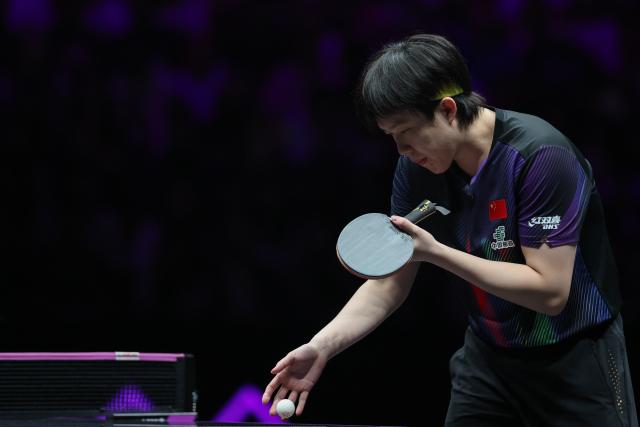 (260312) -- CHONGQING, March 12, 2026 (Xinhua) -- Wang Chuqin of China reacts during the men's singles round of 16 match against Patrick Franziska of Germany at the WTT Champions Chongqing 2026 in southwest China's Chongqing, March 12, 2026. (Xinhua/Huang Wei)