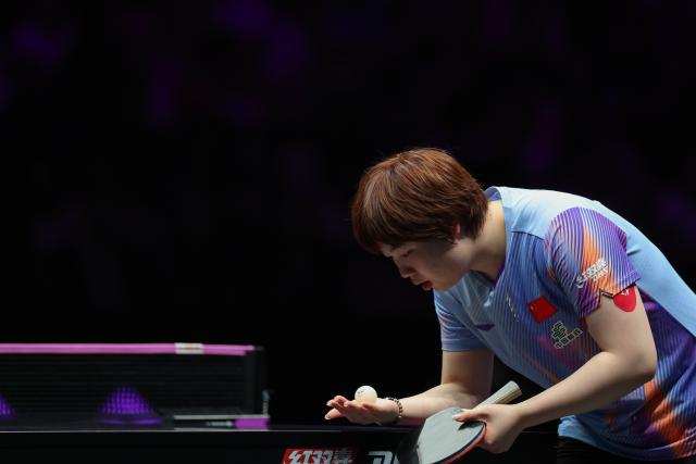 (260312) -- CHONGQING, March 12, 2026 (Xinhua) -- Kuai Man of China reacts during the women's singles round of 16 match against Bruna Takahashi of Brazil at the WTT Champions Chongqing 2026 in southwest China's Chongqing, March 12, 2026. (Xinhua/Huang Wei)