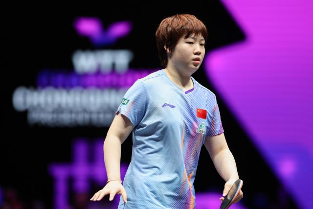 (260312) -- CHONGQING, March 12, 2026 (Xinhua) -- Kuai Man of China reacts during the women's singles round of 16 match against Bruna Takahashi of Brazil at the WTT Champions Chongqing 2026 in southwest China's Chongqing, March 12, 2026. (Xinhua/Huang Wei)