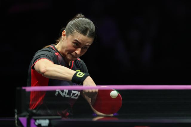 (260312) -- CHONGQING, March 12, 2026 (Xinhua) -- Bruna Takahashi of Brazil hits a return during the women's singles round of 16 match against Kuai Man of China at the WTT Champions Chongqing 2026 in southwest China's Chongqing, March 12, 2026. (Xinhua/Huang Wei)