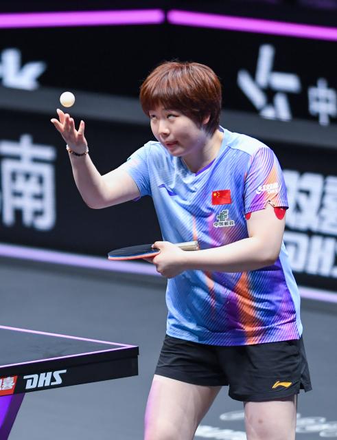 (260312) -- CHONGQING, March 12, 2026 (Xinhua) -- Kuai Man of China serves during the women's singles round of 16 match against Bruna Takahashi of Brazil at the WTT Champions Chongqing 2026 in southwest China's Chongqing, March 12, 2026. (Xinhua/Tang Yi)