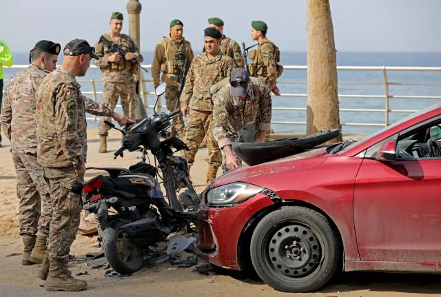 (260312) -- BEIRUT, March 12, 2026 (Xinhua) -- This photo taken on March 12, 2026 shows Lebanese army soldiers inspecting the site hit by an Israeli airstrike in the Ramlet al-Baida area of Beirut, Lebanon. At least 11 people were killed and 32 injured in Israeli airstrikes targeting areas in and around the Lebanese capital early Thursday, said Lebanon's health ministry. (Photo by Bilal Jawich/Xinhua)