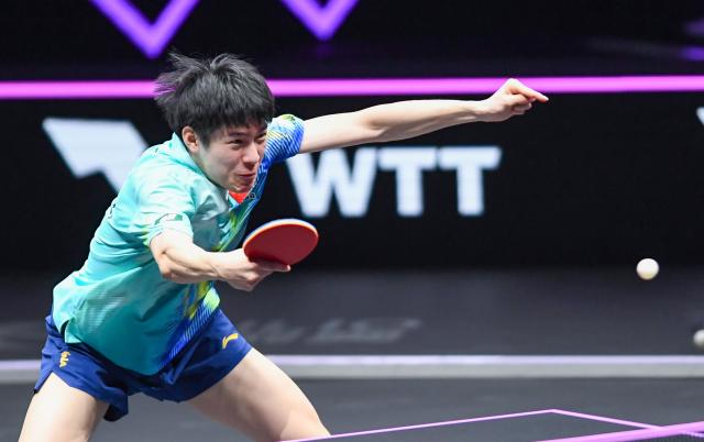 (260312) -- CHONGQING, March 12, 2026 (Xinhua) -- Wen Ruibo hits a return during the men's singles round of 16 match between Wen Ruibo of China and Truls Moregard of Sweden at the WTT Champions Chongqing 2026 in southwest China's Chongqing, March 12, 2026. (Xinhua/Tang Yi)