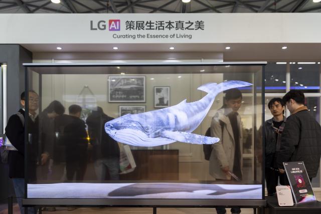 (260312) -- SHANGHAI, March 12, 2026 (Xinhua) -- A transparent OLED TV is pictured at the booth of LG during the 2026 Appliance & Electronics World Expo (AWE2026) in east China's Shanghai, March 12, 2026. The AWE2026 kicked off in Shanghai on Thursday. More than 1,200 enterprises from all over the world gathered at the expo to showcase their latest innovations. (Xinhua/Wang Xiang)