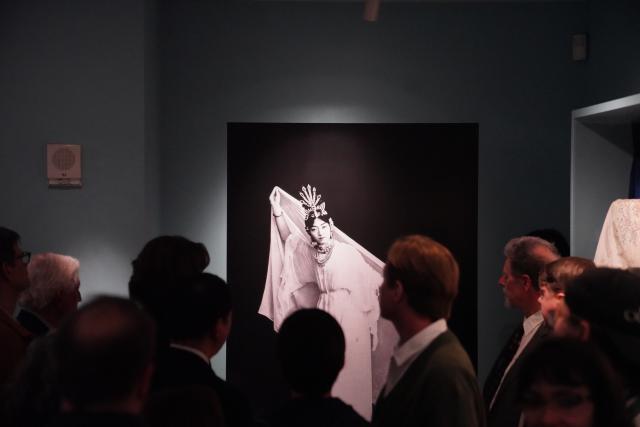 (260312) -- NEW YORK, March 12, 2026 (Xinhua) -- People visit an exhibition titled "The Dancing Goddess: Mei Lanfang in America" in New York, the United States, on March 11, 2026. The exhibition, featuring stage costumes, photographs, performance videos, original production props, and artwork of China's renowned Peking Opera artist Mei Lanfang, opened here on Wednesday to mark the 96th anniversary of his 1930 North American tour. (Xinhua/Zhang Fengguo)