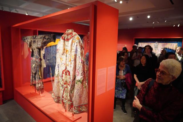 (260312) -- NEW YORK, March 12, 2026 (Xinhua) -- People visit an exhibition titled "The Dancing Goddess: Mei Lanfang in America" in New York, the United States, on March 11, 2026. The exhibition, featuring stage costumes, photographs, performance videos, original production props, and artwork of China's renowned Peking Opera artist Mei Lanfang, opened here on Wednesday to mark the 96th anniversary of his 1930 North American tour. (Xinhua/Zhang Fengguo)