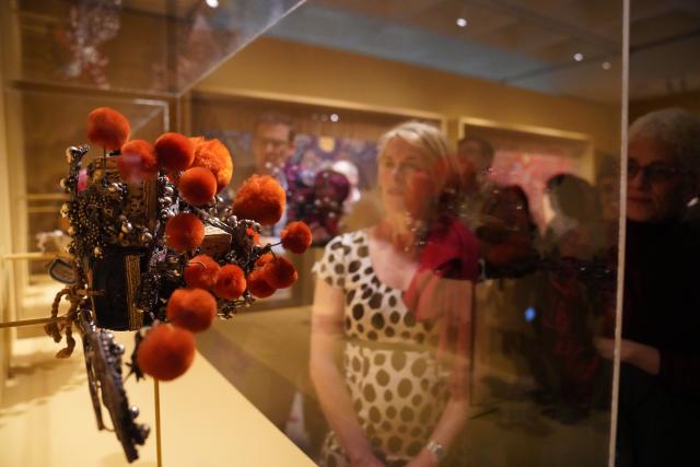 (260312) -- NEW YORK, March 12, 2026 (Xinhua) -- People visit an exhibition titled "The Dancing Goddess: Mei Lanfang in America" in New York, the United States, on March 11, 2026. The exhibition, featuring stage costumes, photographs, performance videos, original production props, and artwork of China's renowned Peking Opera artist Mei Lanfang, opened here on Wednesday to mark the 96th anniversary of his 1930 North American tour. (Xinhua/Zhang Fengguo)