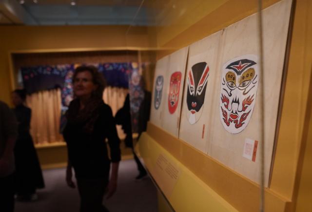 (260312) -- NEW YORK, March 12, 2026 (Xinhua) -- People visit an exhibition titled "The Dancing Goddess: Mei Lanfang in America" in New York, the United States, on March 11, 2026. The exhibition, featuring stage costumes, photographs, performance videos, original production props, and artwork of China's renowned Peking Opera artist Mei Lanfang, opened here on Wednesday to mark the 96th anniversary of his 1930 North American tour. (Xinhua/Zhang Fengguo)