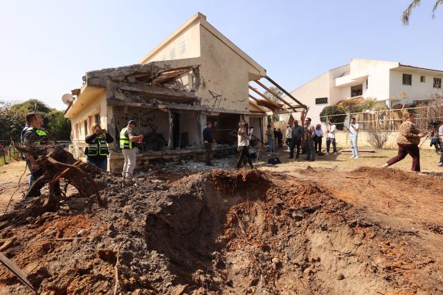 (260312) -- HANIEL, March 12, 2026 (Xinhua) -- This photo taken on March 12, 2026 shows a house damaged by a projectile launched from Lebanon, in Haniel, central Israel. Iran's Islamic Revolution Guard Corps (IRGC) acknowledged joint operation with Hezbollah against Israel. (Photo by Gil Cohen Magen/Xinhua)