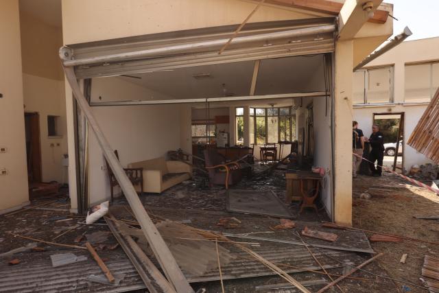 (260312) -- HANIEL, March 12, 2026 (Xinhua) -- This photo taken on March 12, 2026 shows a house damaged by a projectile launched from Lebanon, in Haniel, central Israel. Iran's Islamic Revolution Guard Corps (IRGC) acknowledged joint operation with Hezbollah against Israel. (Photo by Gil Cohen Magen/Xinhua)