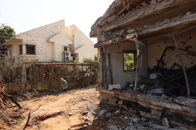 (260312) -- HANIEL, March 12, 2026 (Xinhua) -- This photo taken on March 12, 2026 shows houses damaged by a projectile launched from Lebanon, in Haniel, central Israel. Iran's Islamic Revolution Guard Corps (IRGC) acknowledged joint operation with Hezbollah against Israel. (Photo by Gil Cohen Magen/Xinhua)