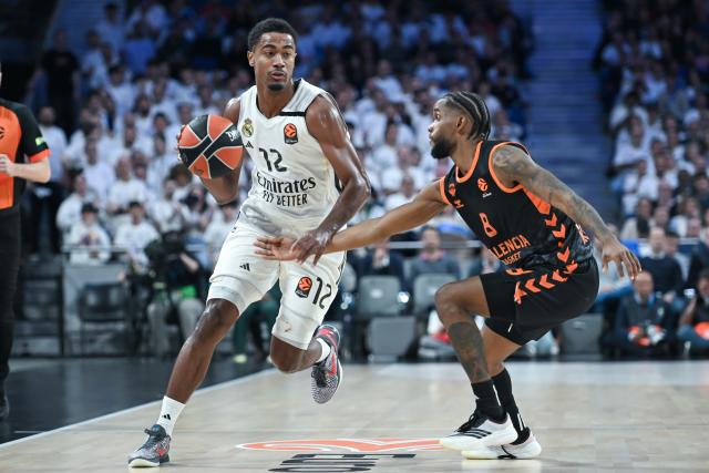 (260313) -- MADRID, March 13, 2026 (Xinhua) -- Real Madrid's Theo Maledon (L) vies with Valencia's Jean Montero during the Euroleague basketball match between Real Madrid and Valencia in Madrid, Spain, on March 12, 2026. (Photo by Gustavo Valiente/Xinhua)
