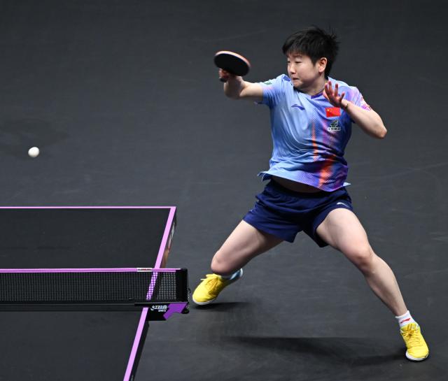(260313) -- CHONGQING, March 13, 2026 (Xinhua) -- Sun Yingsha competes during the women's singles round of 16 match between Sun Yingsha of China and Adriana Diaz of Puerto Rico at the WTT Champions Chongqing 2026 in southwest China's Chongqing, March 13, 2026. (Xinhua/Chen Cheng)