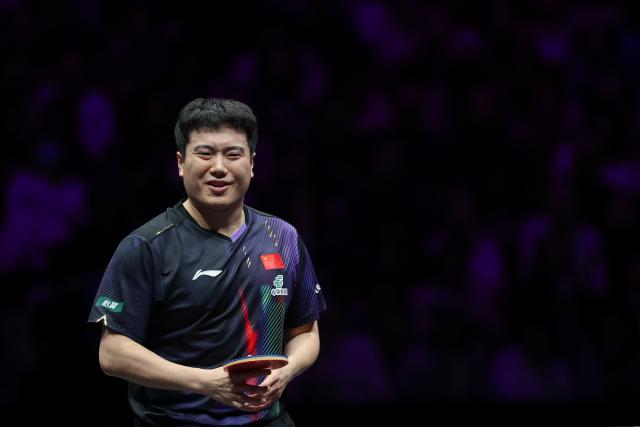 (260313) -- CHONGQING, March 13, 2026 (Xinhua) -- Liang Jingkun reacts during the men's singles round of 16 match between Liang Jingkun of China and Qiu Dang of Germany at the WTT Champions Chongqing 2026 in southwest China's Chongqing, March 13, 2026. (Xinhua/Huang Wei)