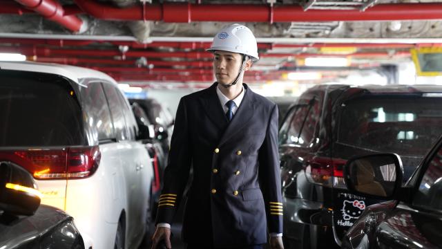 (260313) -- HAIKOU, March 13, 2026 (Xinhua) -- Ro-ro passenger ship captain Huang Wanli inspects the loading situation in the ship's vehicle deck in Haikou, south China's Hainan Province, Feb. 3, 2026. TO GO WITH: "Across China: Captain of a 'ro-ro' passenger ship across south China's Qiongzhou Strait" (Xinhua/Xu Yushen)