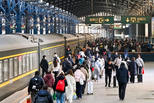 (260313) -- BEIJING, March 13, 2026 (Xinhua) -- Passengers are seen at a platform of Harbin Railway Station in Harbin, northeast China's Heilongjiang Province, March 13, 2026. The 2026 Spring Festival travel rush comes to an end on Friday. (Photo by Yuan Yong/Xinhua)