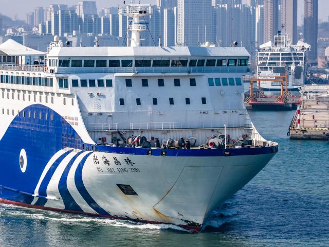 (260313) -- BEIJING, March 13, 2026 (Xinhua) -- A drone photo taken on March 13, 2026 shows a ro-ro passenger ship departing Yantai Port in Yantai, east China's Shandong Province. The 2026 Spring Festival travel rush comes to an end on Friday. (Photo by Zhang Chao/Xinhua)