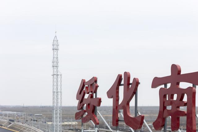 (260313) -- HARBIN, March 13, 2026 (Xinhua) -- A drone photo taken on March 13, 2026 shows the construction site of Suihua South Station of the Harbin-Yichun high-speed railway in Suihua, northeast China's Heilongjiang Province. Workers from China Railway Wuhan Electrification Bureau Group are pressing ahead with the construction of the communication, signaling and power supply systems for the 318-kilometer Harbin-Yichun high-speed railway. At present, 90% of the project has been completed. (Xinhua/Zhang Tao)