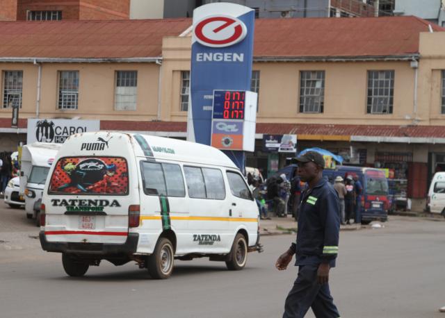 (260313) -- HARARE, March 13, 2026 (Xinhua) -- A van moves past a fuel station in Harare, Zimbabwe, on March 11, 2026. Amid rising crude oil prices due to the conflict in the Middle East, Zimbabweans are already feeling the squeeze at the fuel pump.
  Commuters in Harare, Zimbabwe's capital, are bearing the brunt of higher transportation costs, as fuel price hikes have forced some public transport operators to raise fares.
  TO GO WITH "Roundup: Rising fuel prices weigh on Zimbabwean commuters amid Middle East crisis" (Photo by Tafara Mugwara/Xinhua)