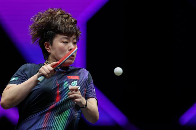 (260313) -- CHONGQING, March 13, 2026 (Xinhua) -- Wang Yidi of China hits a return during the women's singles round of 16 match against Liu Yangzi of Australia at the WTT Champions Chongqing 2026 in southwest China's Chongqing, March 13, 2026. (Xinhua/Huang Wei)