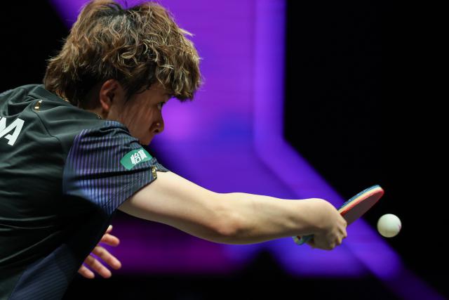 (260313) -- CHONGQING, March 13, 2026 (Xinhua) -- Wang Yidi of China hits a return during the women's singles round of 16 match against Liu Yangzi of Australia at the WTT Champions Chongqing 2026 in southwest China's Chongqing, March 13, 2026. (Xinhua/Huang Wei)