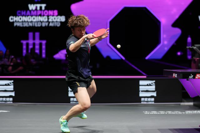 (260313) -- CHONGQING, March 13, 2026 (Xinhua) -- Wang Yidi of China hits a return during the women's singles round of 16 match against Liu Yangzi of Australia at the WTT Champions Chongqing 2026 in southwest China's Chongqing, March 13, 2026. (Xinhua/Huang Wei)