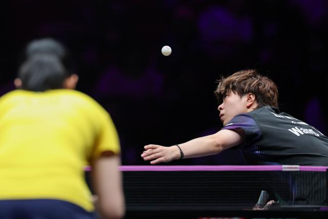 (260313) -- CHONGQING, March 13, 2026 (Xinhua) -- Wang Yidi of China serves during the women's singles round of 16 match against Liu Yangzi of Australia at the WTT Champions Chongqing 2026 in southwest China's Chongqing, March 13, 2026. (Xinhua/Huang Wei)