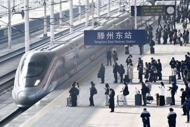 (260313) -- BEIJING, March 13, 2026 (Xinhua) -- Passengers are seen at a platform of Tengzhou East Railway Station in Zaozhuang, east China's Shandong Province, March 13, 2026. The total number of inter-regional passenger trips across China during the 40-day Spring Festival travel rush, which concluded on Friday, is estimated to reach a record 9.4 billion, according to data from the Ministry of Transport. (Photo by Li Zongxian/Xinhua)