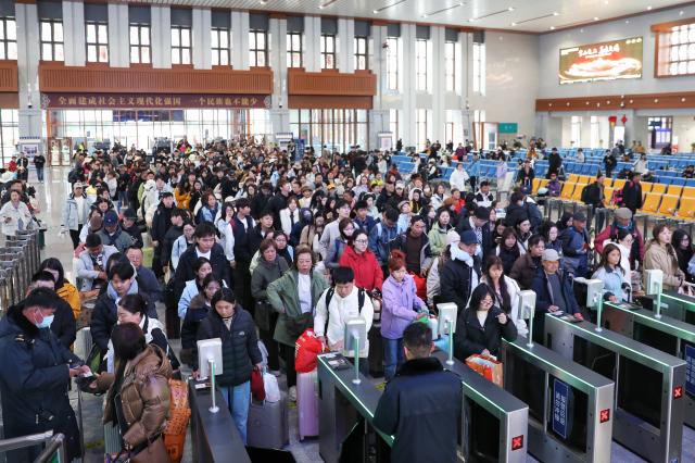 (260313) -- BEIJING, March 13, 2026 (Xinhua) -- Passengers check in at Shangri-La Railway Station in Shangri-La, southwest China's Yunnan Province, March 13, 2026. The total number of inter-regional passenger trips across China during the 40-day Spring Festival travel rush, which concluded on Friday, is estimated to reach a record 9.4 billion, according to data from the Ministry of Transport. (Photo by Yang Zixuan/Xinhua)