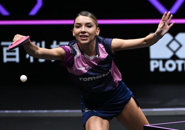 (260313) -- CHONGQING, March 13, 2026 (Xinhua) -- Bernadette Szocs of Romania hits a return during the women's singles round of 16 match against Chen Yi of China at the WTT Champions Chongqing 2026 in southwest China's Chongqing, March 13, 2026. (Xinhua/Chen Cheng)