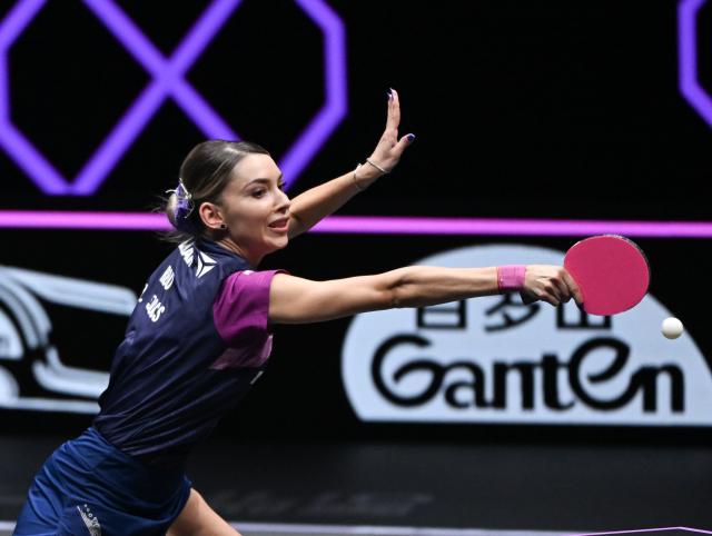 (260313) -- CHONGQING, March 13, 2026 (Xinhua) -- Bernadette Szocs of Romania hits a return during the women's singles round of 16 match against Chen Yi of China at the WTT Champions Chongqing 2026 in southwest China's Chongqing, March 13, 2026. (Xinhua/Chen Cheng)