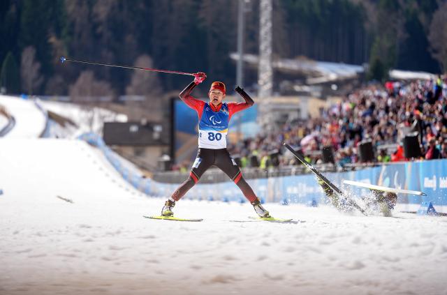 (260313) -- TESERO, March 13, 2026 (Xinhua) -- Cai Jiayun of China celebrates after crowning the para biathlon men's sprint pursuit standing at the Milan-Cortina 2026 Paralympic Winter Games in Tesero, Italy, March 13, 2026. (Xinhua/Hou Zhaokang)