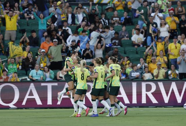 (260313) -- PERTH, March 13, 2026 (Xinhua) -- Alanna Kennedy (2nd L) of Australia celebrate scoring during the quarterfinal of Women's Asian Cup between Australia and the Democratic People's Republic of Korea (DPRK) at Perth Rectangular Stadium in Perth, Australia, March 13, 2026. (Xinhua/Ma Ping)
