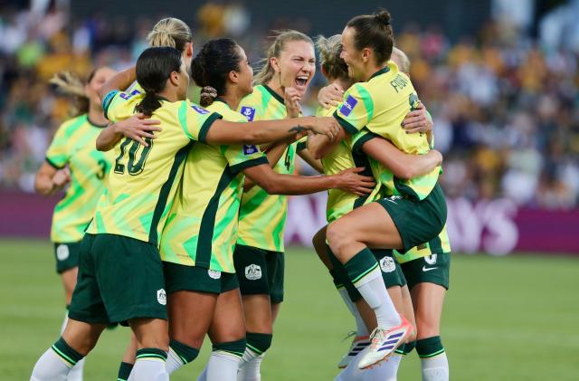 (260313) -- PERTH, March 13, 2026 (Xinhua) -- Players of Australia celebrate scoring during the quarterfinal of Women's Asian Cup between Australia and the Democratic People's Republic of Korea (DPRK) at Perth Rectangular Stadium in Perth, Australia, March 13, 2026. (Photo by Zhou Dan/Xinhua)