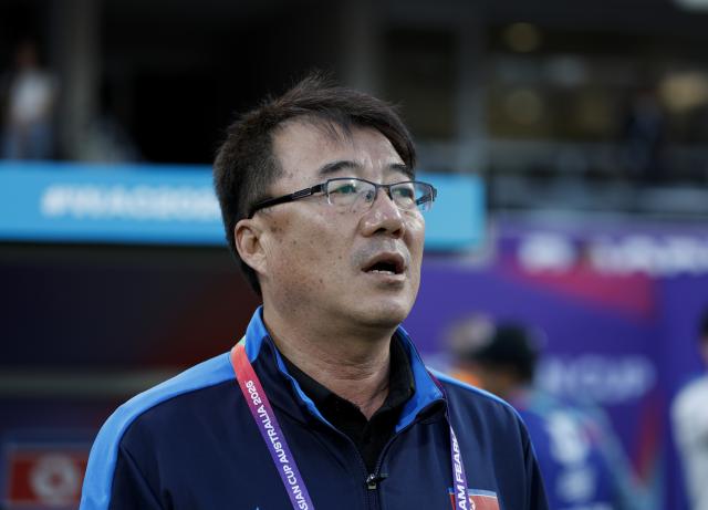 (260313) -- PERTH, March 13, 2026 (Xinhua) -- Ri Song Ho, head coach of DPRK, reacts before the quarterfinal of Women's Asian Cup between Australia and the Democratic People's Republic of Korea (DPRK) at Perth Rectangular Stadium in Perth, Australia, March 13, 2026. (Xinhua/Ma Ping)