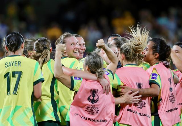 (260313) -- PERTH, March 13, 2026 (Xinhua) -- Team Australia celebrate winning the quarterfinal of Women's Asian Cup between Australia and the Democratic People's Republic of Korea (DPRK) at Perth Rectangular Stadium in Perth, Australia, March 13, 2026. (Photo by Zhou Dan/Xinhua)