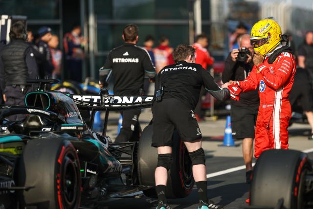 (260313) -- SHANGHAI, March 13, 2026 (Xinhua) -- Ferrari's Lewis Hamilton (R) of Britain reacts after the Sprint Qualifying of Formula One Chinese Grand Prix at Shanghai International Circuit in Shanghai, China, March 13, 2026. (Photo by Qian Jun/Xinhua)