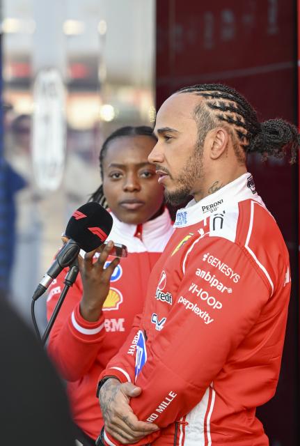 (260313) -- SHANGHAI, March 13, 2026 (Xinhua) -- Ferrari's Lewis Hamilton of Britain reacts after the Sprint Qualifying of Formula One Chinese Grand Prix at Shanghai International Circuit in Shanghai, China, March 13, 2026. (Xinhua/Chen Haoming)