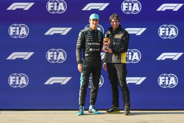 (260313) -- SHANGHAI, March 13, 2026 (Xinhua) -- Mercedes' George Russell (L) of Britain celebrates after the Sprint Qualifying of Formula One Chinese Grand Prix at Shanghai International Circuit in Shanghai, China, March 13, 2026. (Photo by Qian Jun/Xinhua)