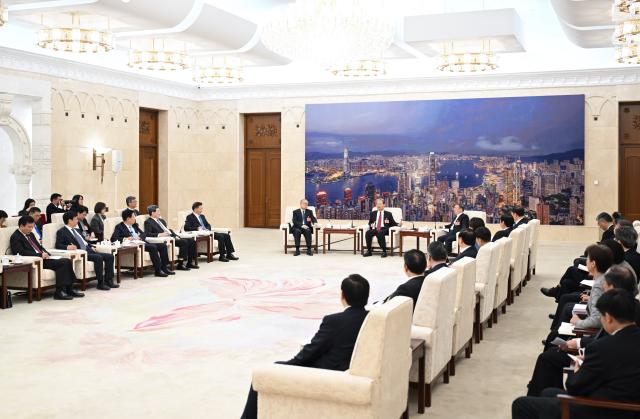 (260313) -- BEIJING, March 13, 2026 (Xinhua) -- Zhao Leji, a member of the Standing Committee of the Political Bureau of the Communist Party of China Central Committee and chairman of the National People's Congress (NPC) Standing Committee, meets with journalists covering the fourth session of the 14th NPC, expressing his appreciation for their work, at the Great Hall of the People in Beijing, capital of China, March 12, 2026. (Xinhua/Li Xiang)