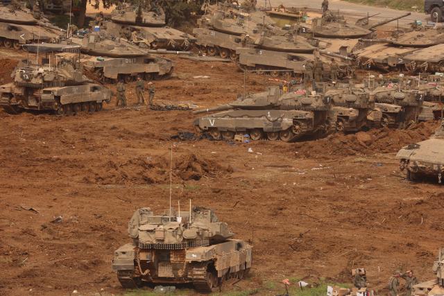 (260313) -- JERUSALEM, March 13, 2026 (Xinhua) -- Israeli troops stage at a staging area in northern Israel near the border with Lebanon, March 13, 2026. The Israeli army said Friday in a statement that it has begun a broad reinforcement of troops along the northern border with Lebanon to strengthen "readiness for various offensive and defensive scenarios," amid ongoing fighting with Hezbollah. (Photo by Gil Cohen Magen/Xinhua)
