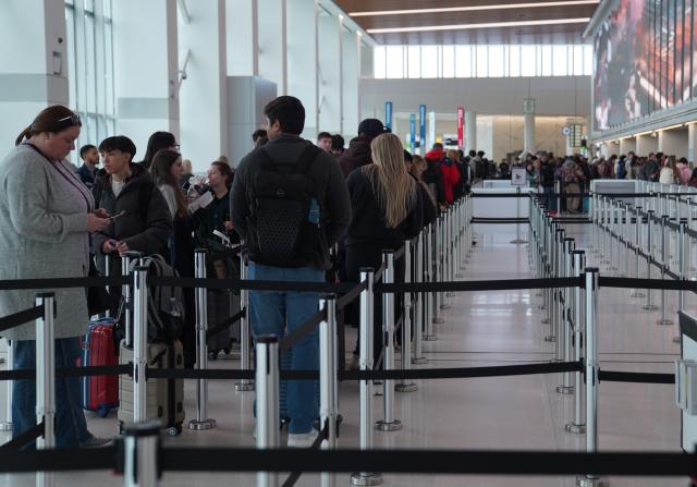(260313) -- NEW YORK, March 13, 2026 (Xinhua) -- People line up to go through security at LaGuardia Airport in New York, the United States, on March 13, 2026. Major U.S. airports are seeing long lines at security checkpoints amid an ongoing partial government shutdown that has dragged on for nearly a month. (Xinhua/Zhang Fengguo)
